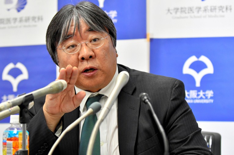 Osaka University professor Yoshiki Sawa explains the clinical study in a news conference held in the university's Tokyo Office.