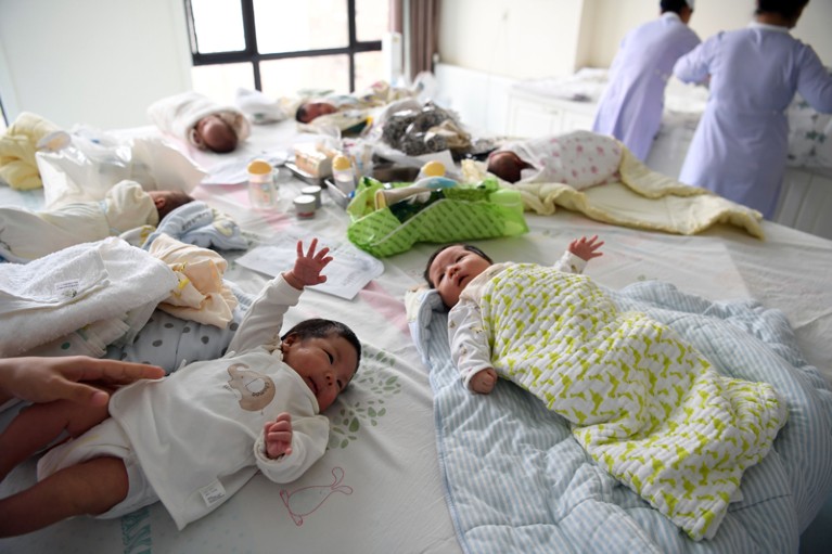 Staff members take care of babies in a postnatal confinement centre in Hefei, China