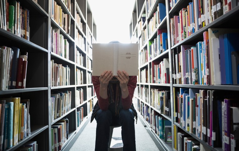 Person reading in library