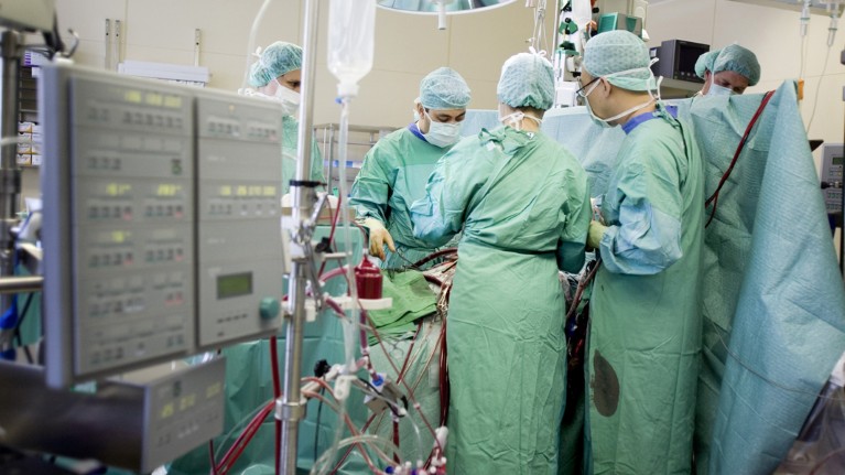 A cardiac surgeon and team carry out heart bypass surgery in Germany