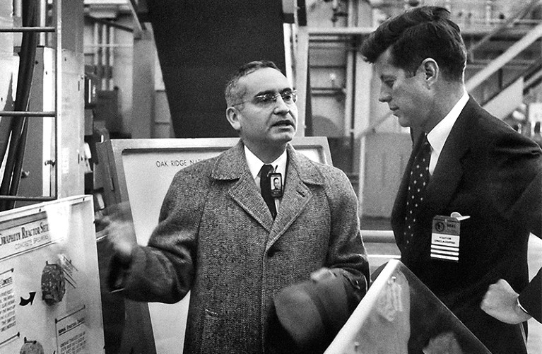 Weinberg (c) talks to Kennedy (r) and gestures at display cases at Oak Ridge Natl Lab in 1959