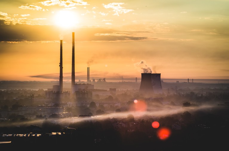 Sunrise over Cracow with chimneys