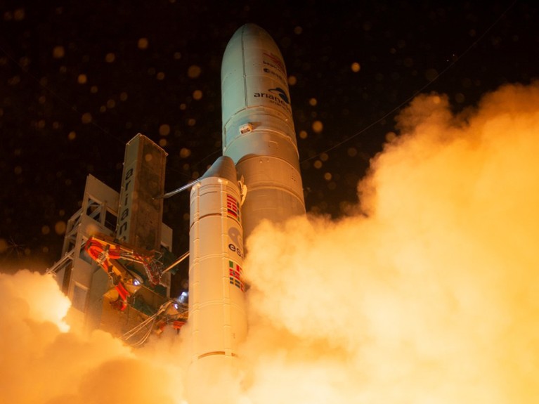 Orange smoke billows out during BepiColombo's liftoff on the Ariane 5 rocket on 20th Oct 2018