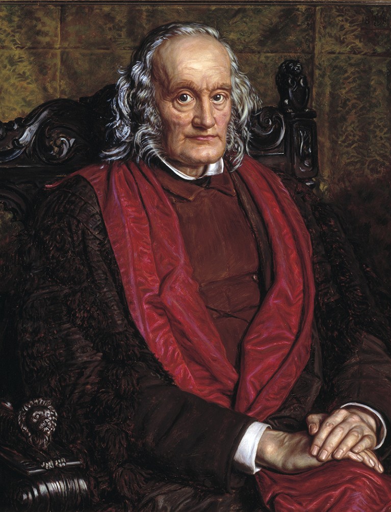 Seated portrait of Richard Owen in a red trimmed coat as painted by William Holman Hunt.