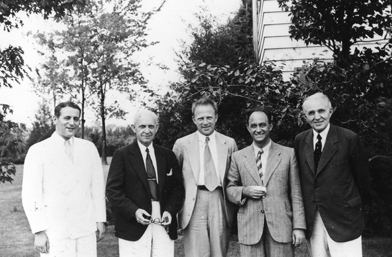 L-R: group photograph of Sam Goudsmit, Clarence Yoakum, Werner Heisenberg, Enrico Fermi, Edward H. Kraus