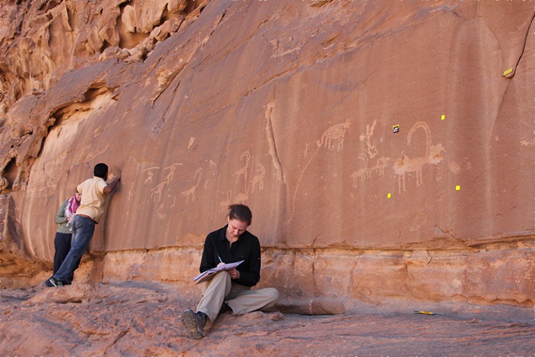 L-R: Lisa Mol, Mohammed Al Zalabih and Rachel King (seated) examine site 6 at Wadi Rum, Jordan.