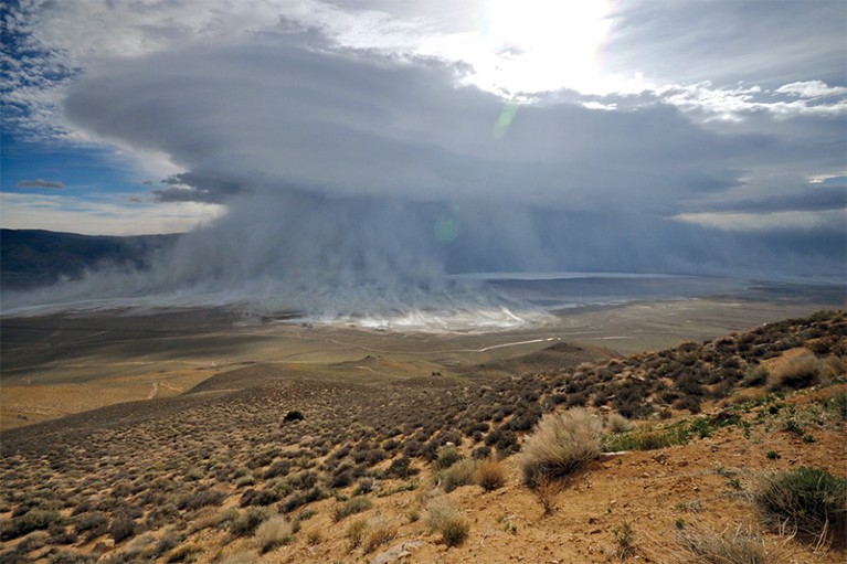 A huge dust cloud forming over Owens Valley and lake in 2010