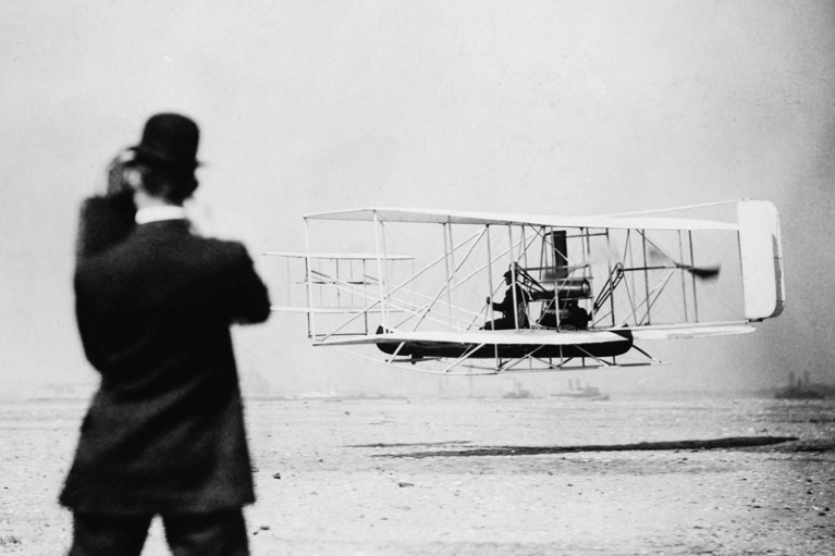 Wilbur Wright demonstrates flying the Wright Brothers' airplane