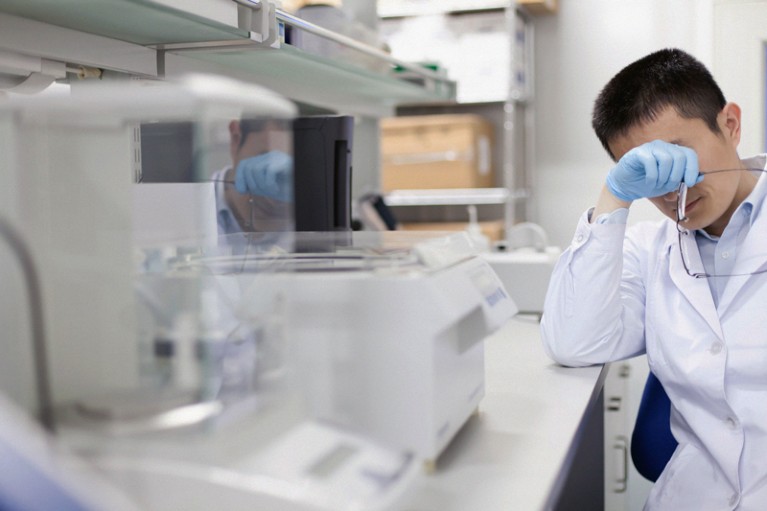 Tired researcher working a lab