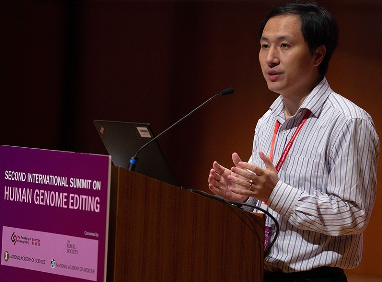 He Jiankui talks at a podium during his presentation on the 28th November.