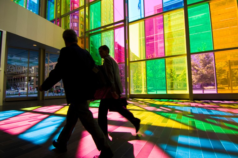 Silhouettes of men walking in the Palais de Congres de Montreal