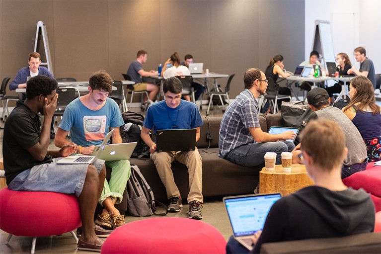 Participants work on their laptops during the summer 2018 Neurohackademy