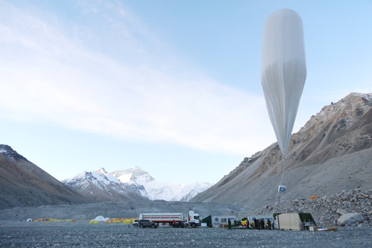 Scientists prepare an observation balloon in the Himalayas