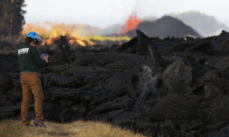 Geologist inspects lava flow