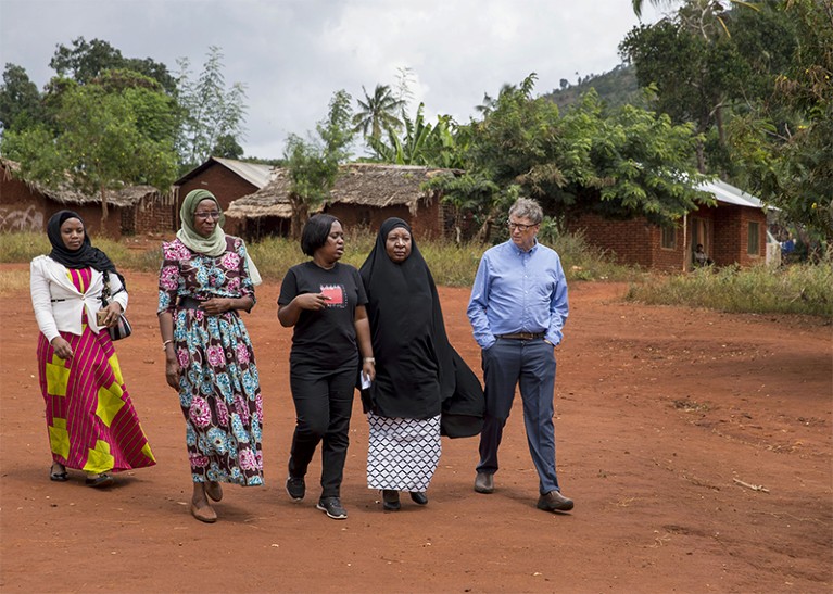 Health workers give Bill Gates a tour of their work in the village of Kicheba, Tanzania, in 2017