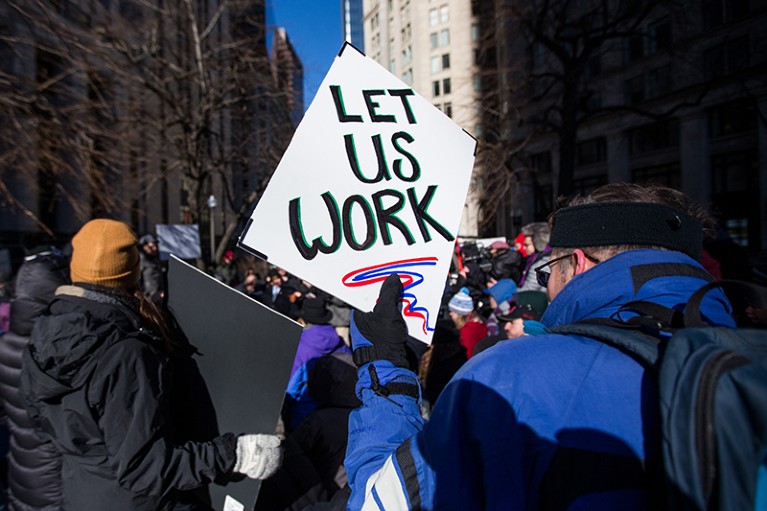 Government workers rally to end the U.S. government shutdown