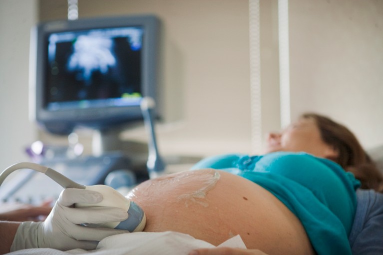 Pregnant woman receiving an ultra-sound scan