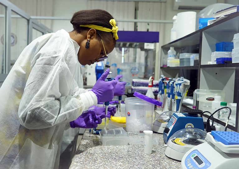 Grad students using one of the CRISPR tests in Nigeria.