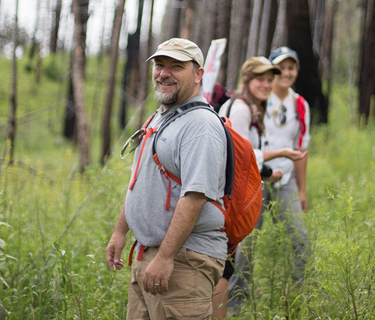 Terry McGlynn smiling while instructing participants in fieldwork collecting ants for Southwestern Research Portal