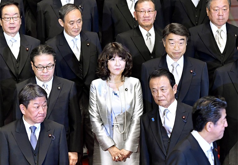 Satsuki Katayama stands among her cabinet minister colleagues
