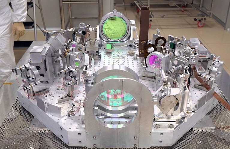 Complicated optic array with measurement systems and coloured lenses in the middle of the VIRGO laboratory in Italy
