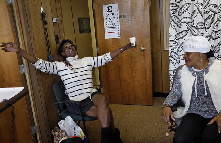 Kimberly Lea (left) talks with another client, Vernada Jones at Hope Home in Oakland, Calif.