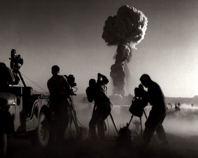 Government filmmakers document an atomic bomb explosion at the test site in Nevada. 1957