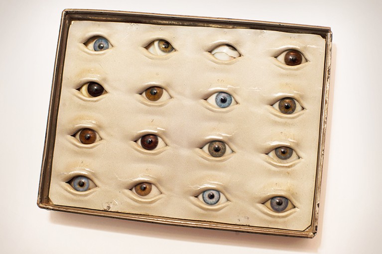 A box containing glass eyes with irises of various colours.