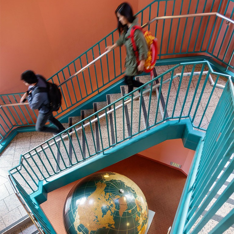 Students descending the stairs at Leavey Library.