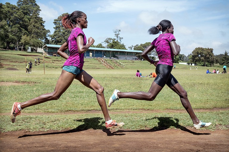 Female athletes training on a running track in Iten, Kenya