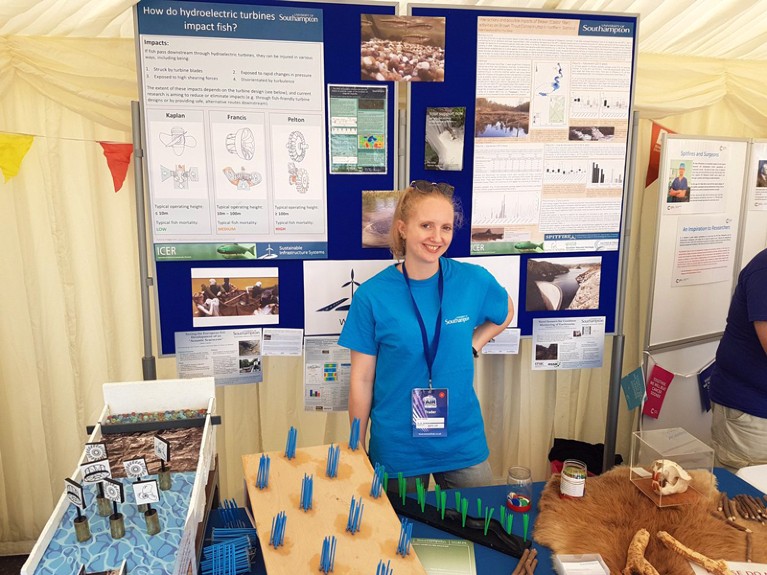 Helen Currie poses with public-engagement materials at the Bournemouth Air Festival, UK.