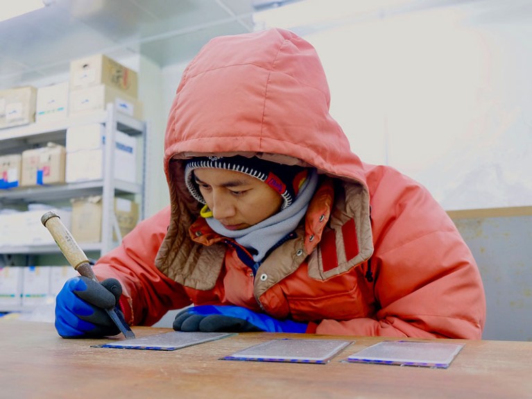 Pat Wongpan works on sea-ice sections.