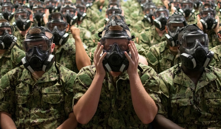 U.S. Navy recruits test their personal protective equipment