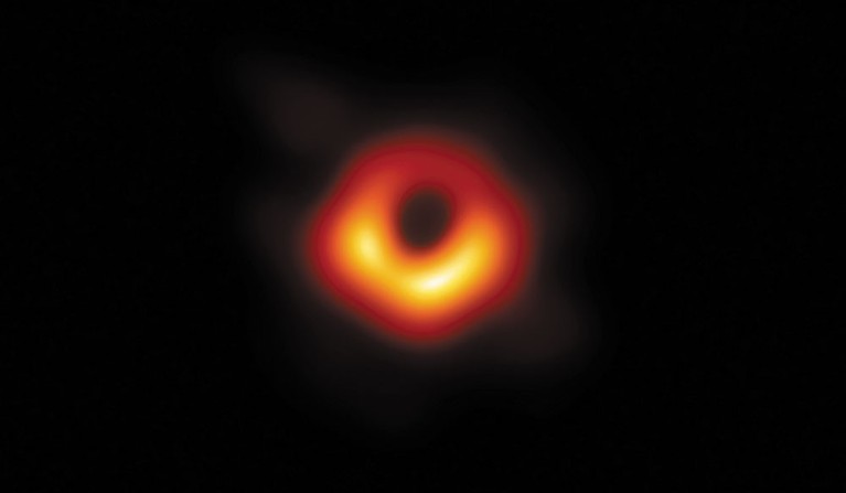 A glowing orange ring on a black background.