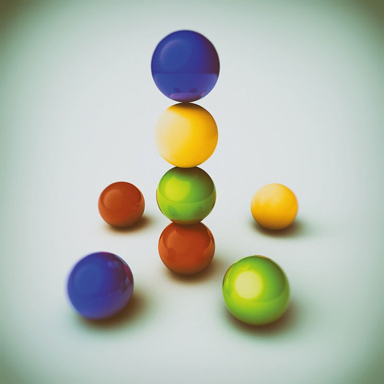 Artistic image of coloured balls stacked on top of one another
