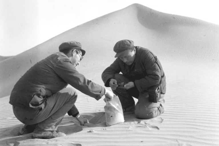 Chinese Academy of Science researchers take sand samples in northwest China's Lop Nur Desert.