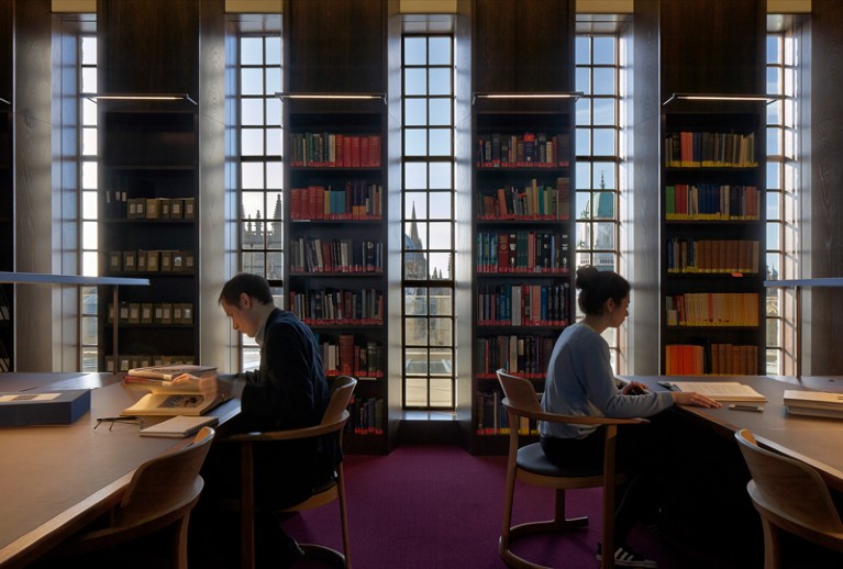 People work in the Reading Room at Weston Library at the University of Oxford