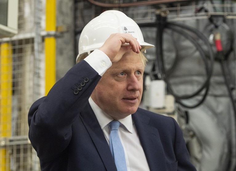Boris Johnson gestures during his visit to the Fusion Energy Research Centre