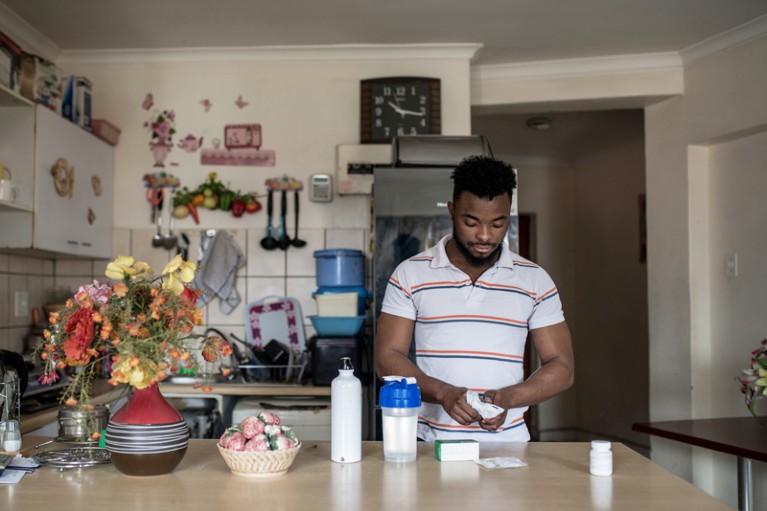 Grajevis Bakatunkanda, who has sickle cell anaemia, takes his medication in his family home in Wynberg, Cape Town, South Africa.