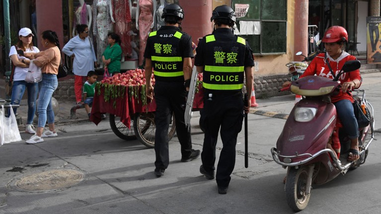 This photo, taken on 4 June 2019 ,shows police officers patrolling in Kashgar, in China's western Xinjiang region.