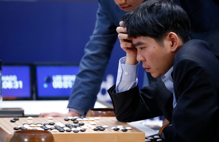 South Korean professional Go player Lee Sedol reviews a match against against Google's artificial intelligence program, AlphaGo