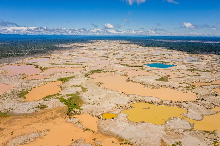Aerial view of the remains of the illegal La Pampa gold mine, in the Peruvian Amazon rain forest