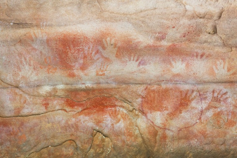 : Red Hands Aboriginal cave painting in the Blue Mountains National Park, Sydney, NSW, Australia