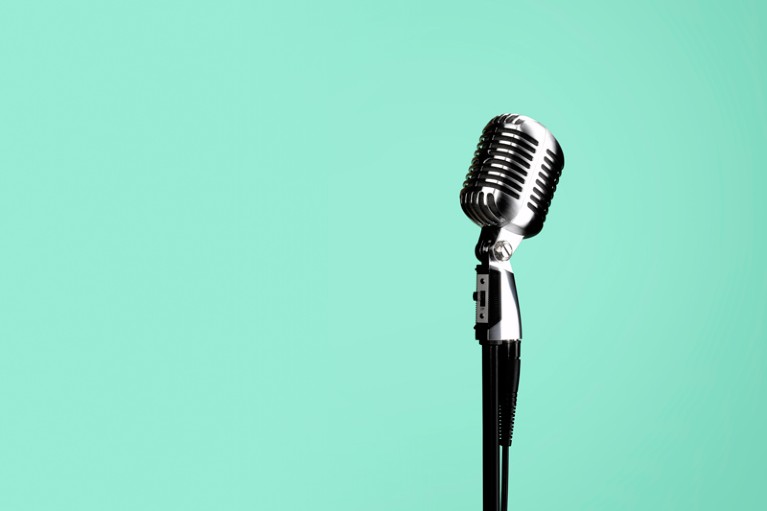 Freestanding microphone on green background