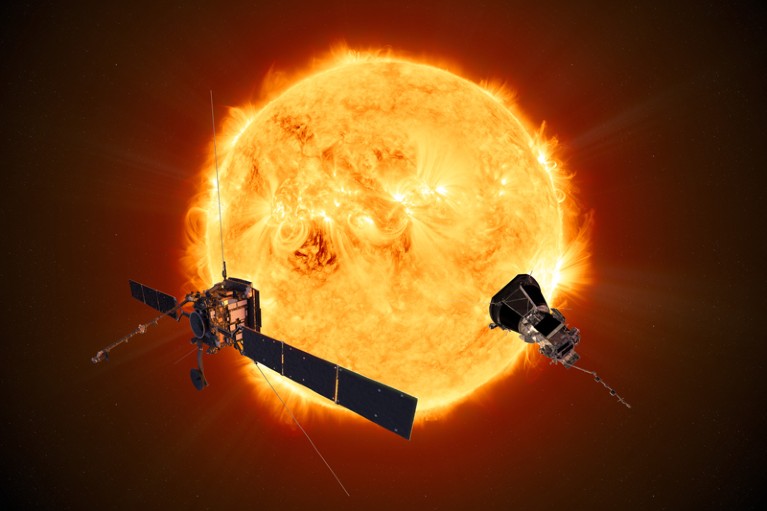 Two spacecraft in front of the Sun.