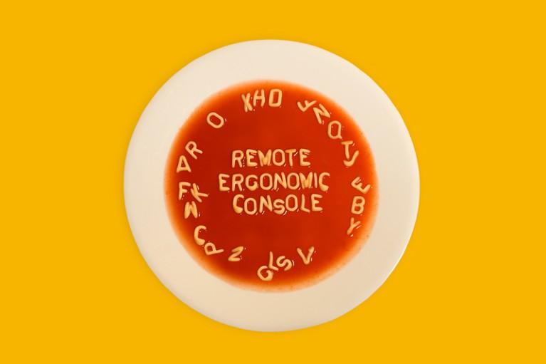 Alphabet soup letters in a bowl spell out "remote ergonomic console"