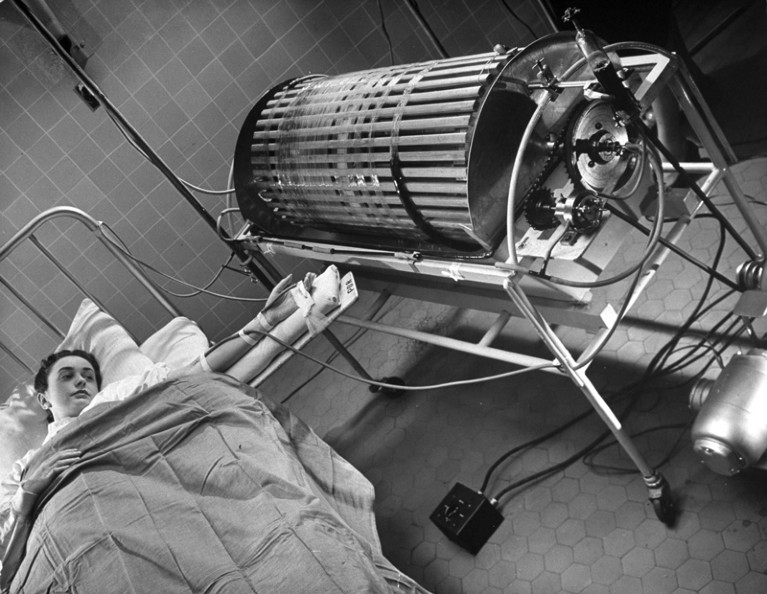 A patient receives treatment from a early dialysis machine in 1947