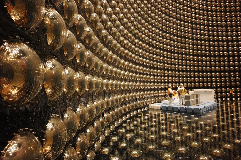 Technicians work inside the Super-Kamiokande detector