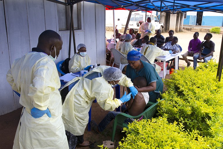 An Ebola treatment centre with health workers vaccinating the population in Beni, DRC