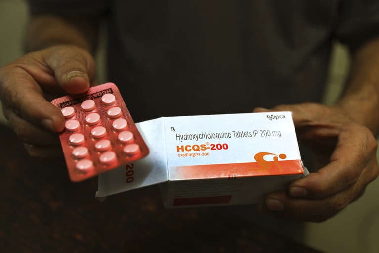 A chemist displays hydroxychloroquine tablets in New Delhi, India